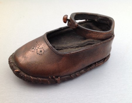 Babyschoentje brons € 25,-